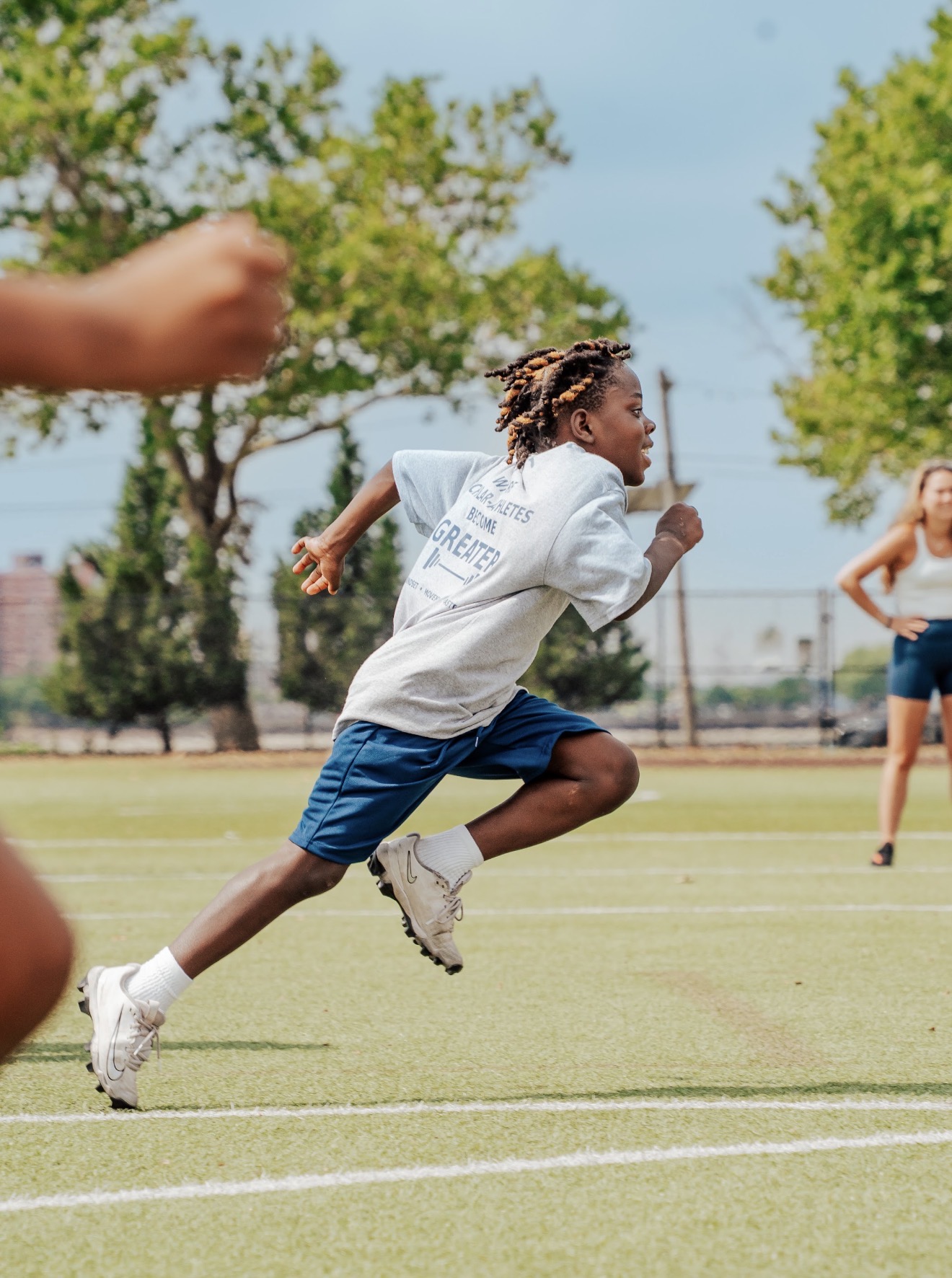 Greater Leaps scholar-athlete sprinting during summer camp training