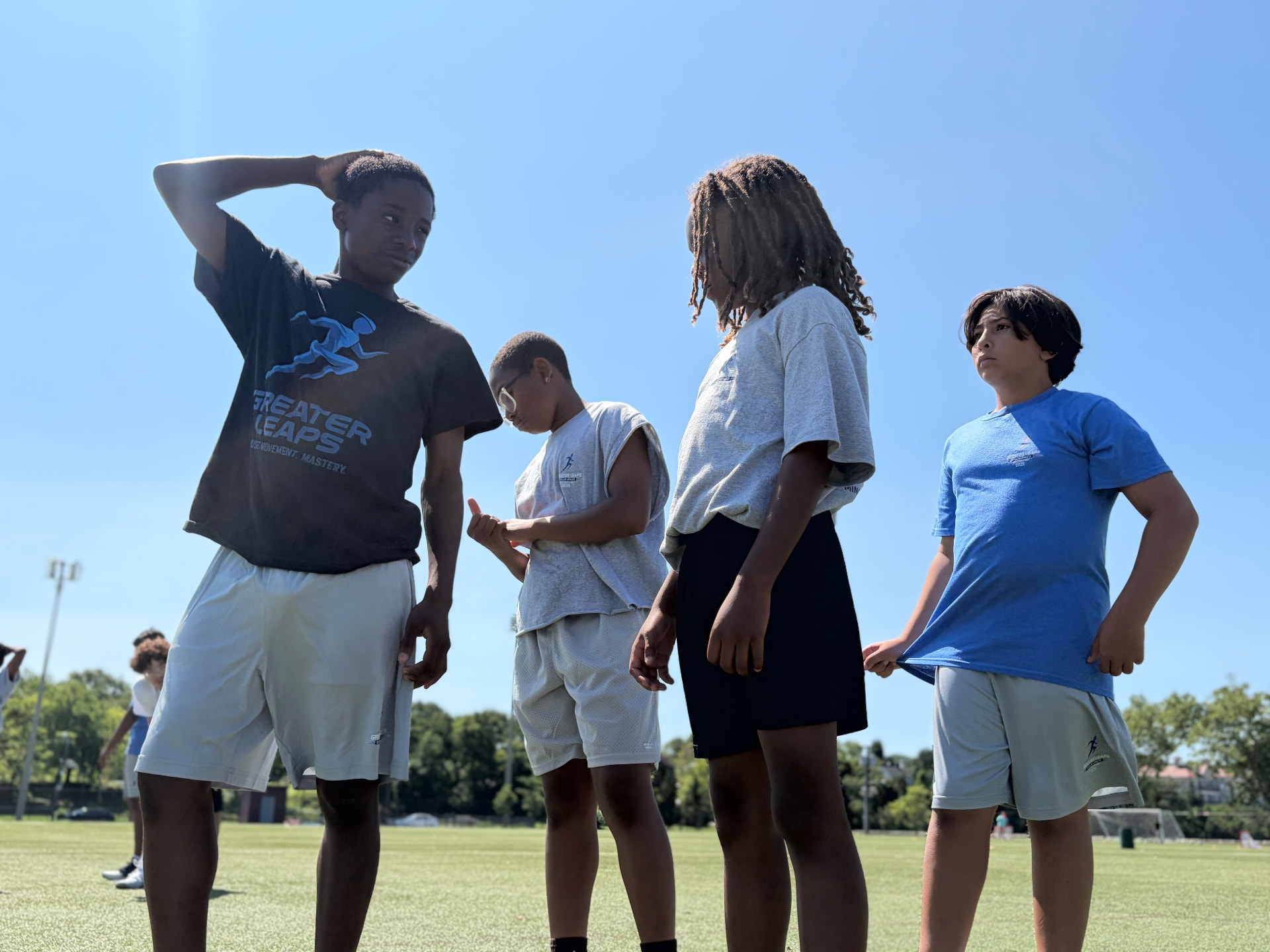 Group of scholar-athletes in Greater Leaps gear on the field